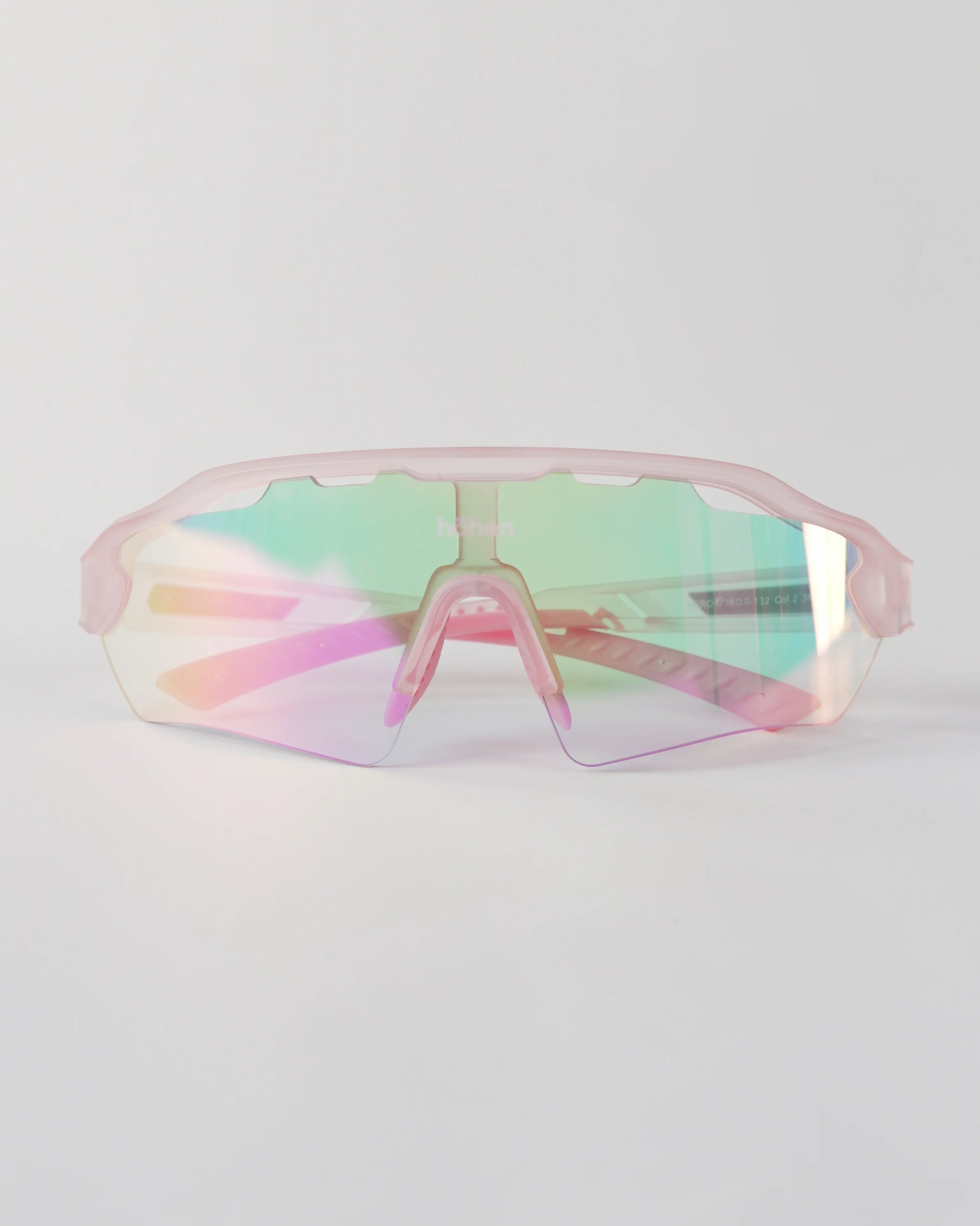Front view of höhen aero women's sports sunglasses with a pink iridescent shield lens and matching frosted pink frame
