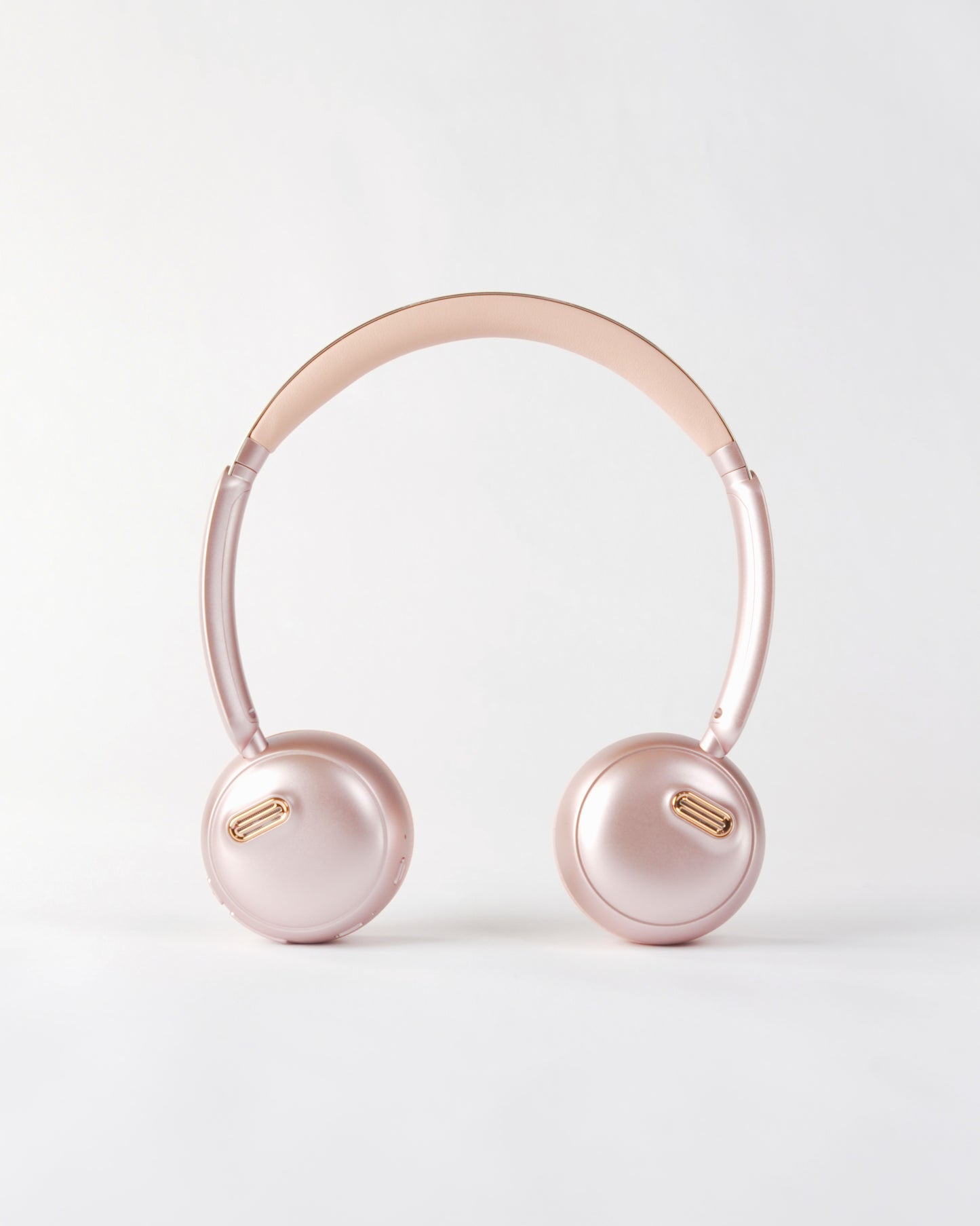 Outer view of the höhen aura mini headphones featuring a sleek metallic pink finish
