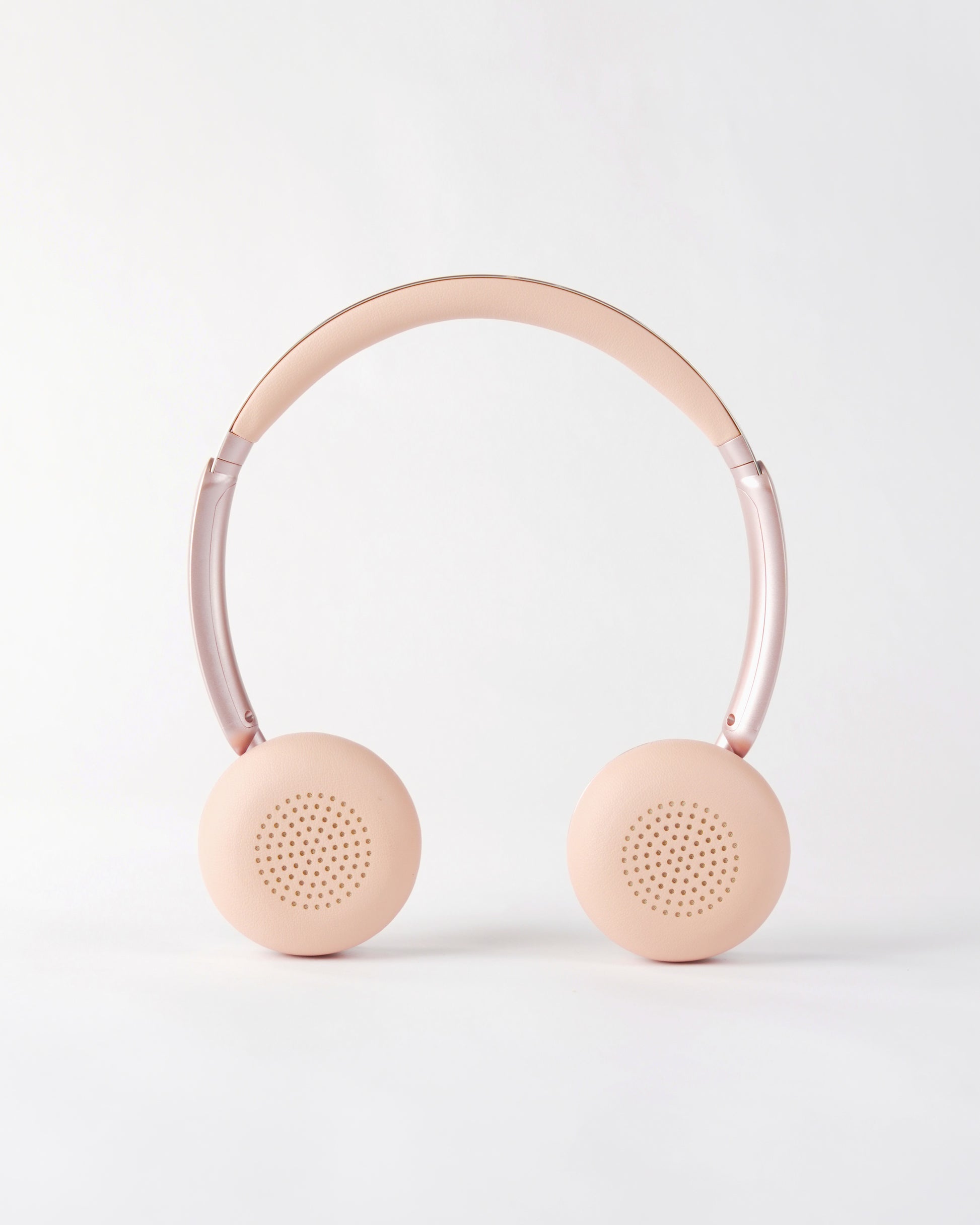 Frontal view of the höhen aura mini headphones in pink, showing the soft cushioned ear pads and adjustable headband
