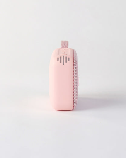 Side profile of the höhen move speaker in pink, showing the smooth matte finish and side sound ventilation slots